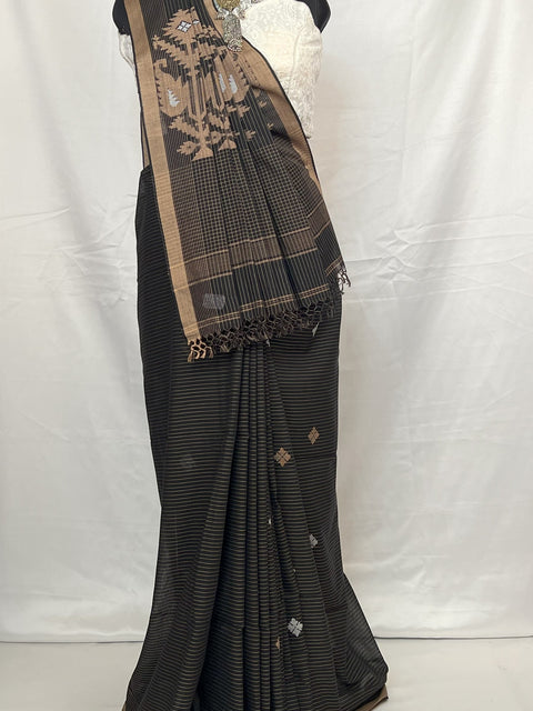 Black saree with gold border on a mannequin against a white background