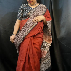 Traditional handwoven Kota Doria saree with soft blue base and golden pattern