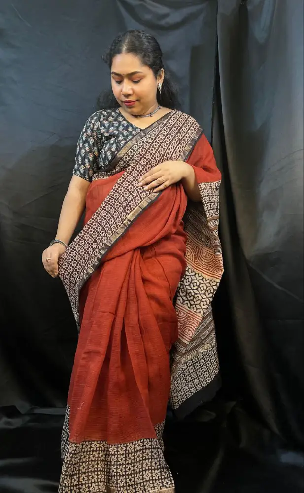 Traditional handwoven Kota Doria saree with soft blue base and golden pattern