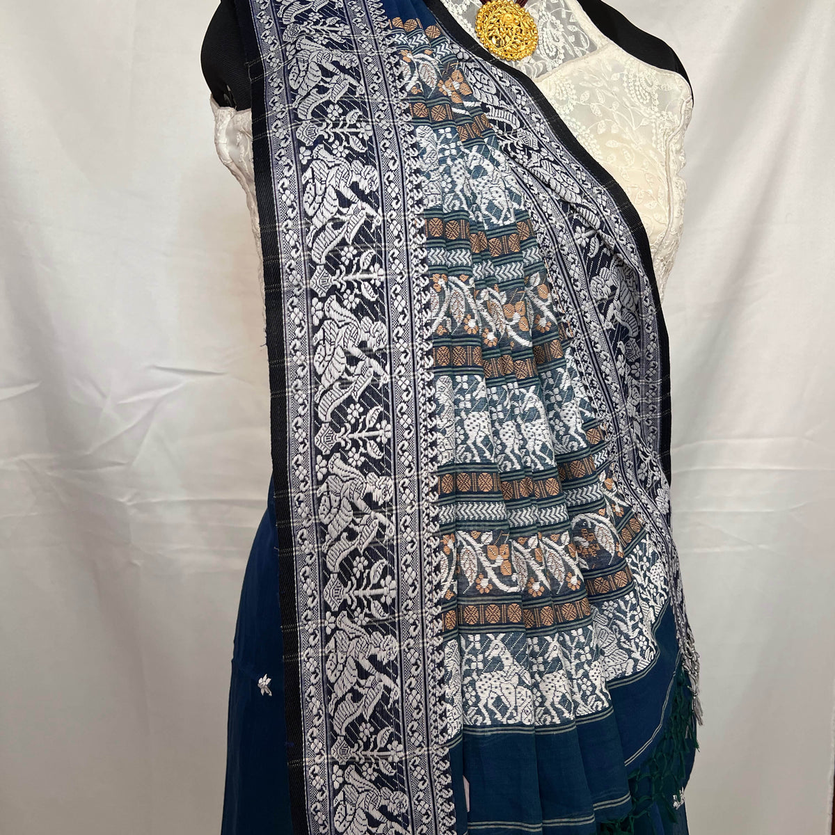 Festive wear Baluchari handloom saree in peacock blue cotton with ornate weaving.