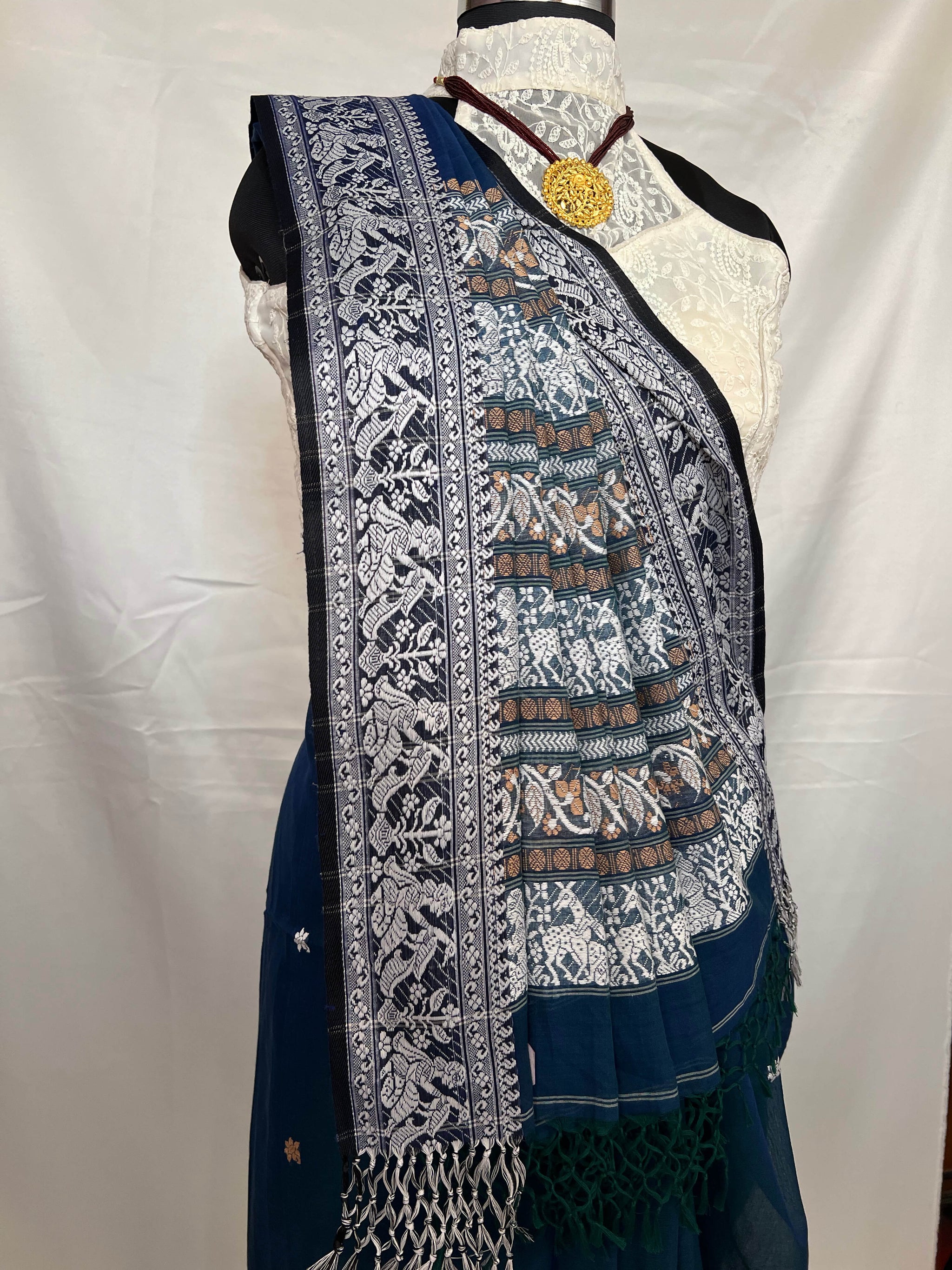 Festive wear Baluchari handloom saree in peacock blue cotton with ornate weaving.
