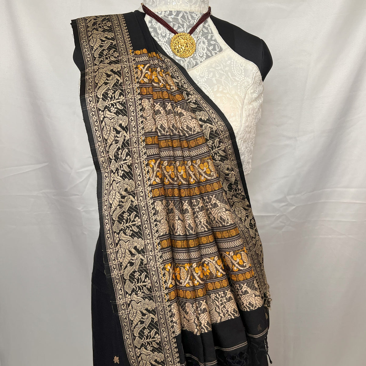 Traditional black Cotton Baluchari Saree styled for festive wear.