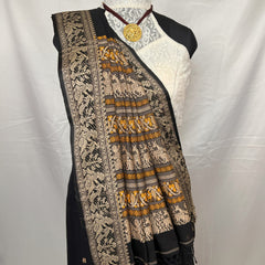 Traditional black Cotton Baluchari Saree styled for festive wear.