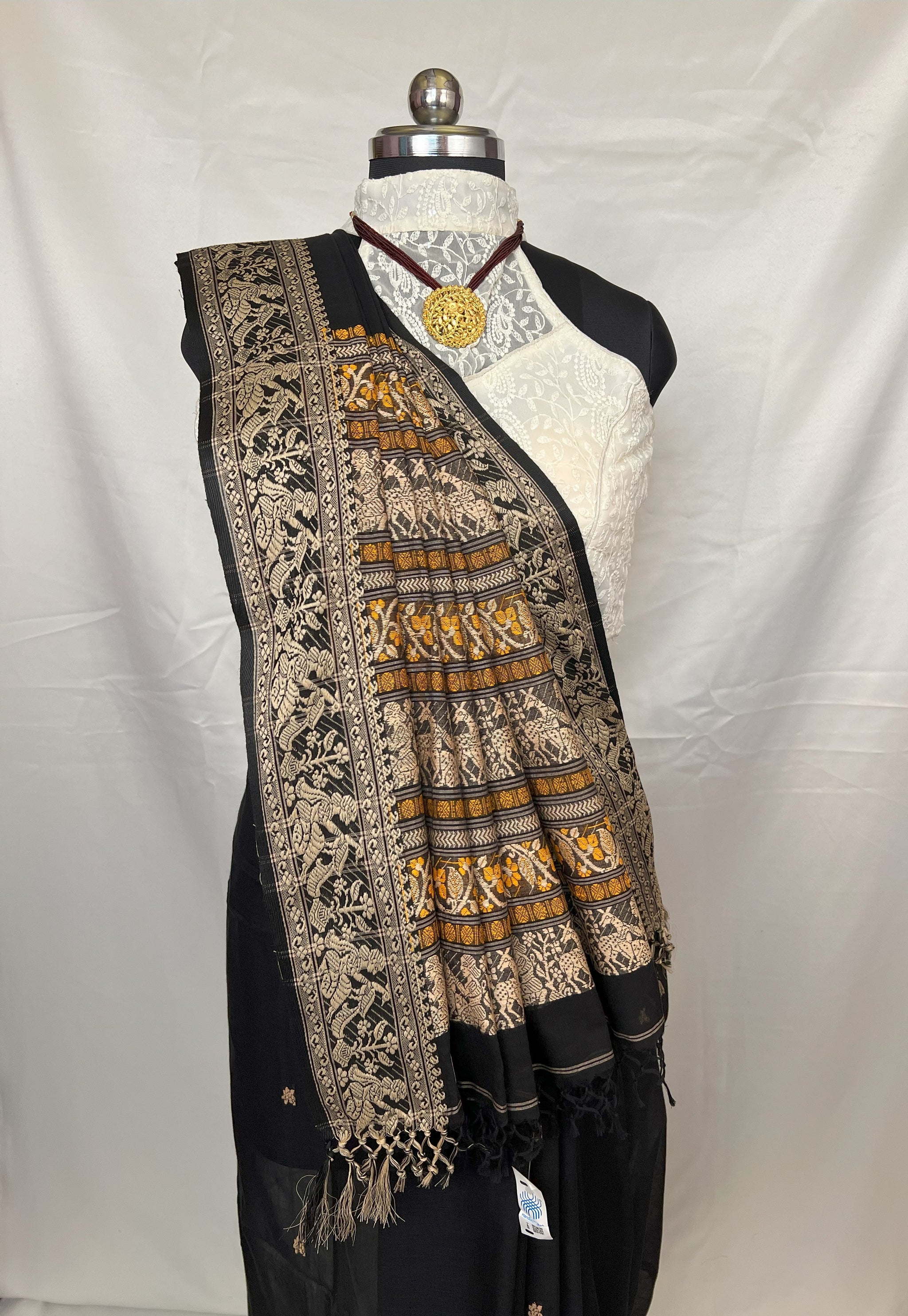 Traditional black Cotton Baluchari Saree styled for festive wear.