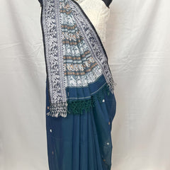 Traditional Baluchari saree pallu design in white weaving on peacock blue cotton fabric.