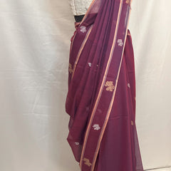 Traditional Bengali Baluchari saree in peacock purple cotton, showcasing heritage weaving art.