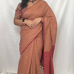 Full view of beige colour cotton handloom saree with blouse piece.