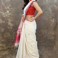 Traditional Bengali saree in red and white for Durga Puja festival look.