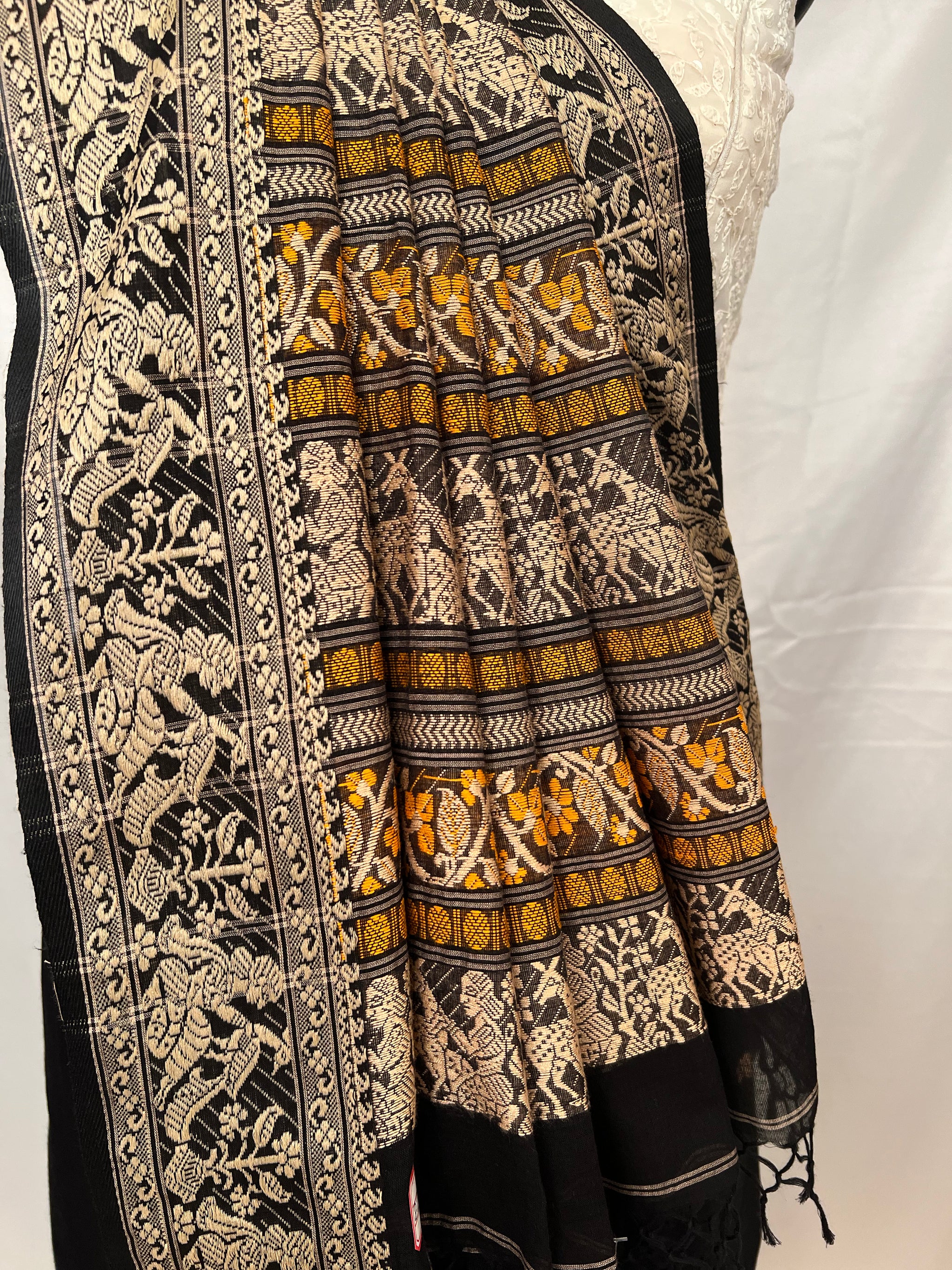 Cotton Baluchari Saree – Draping style showing black handloom fabric.