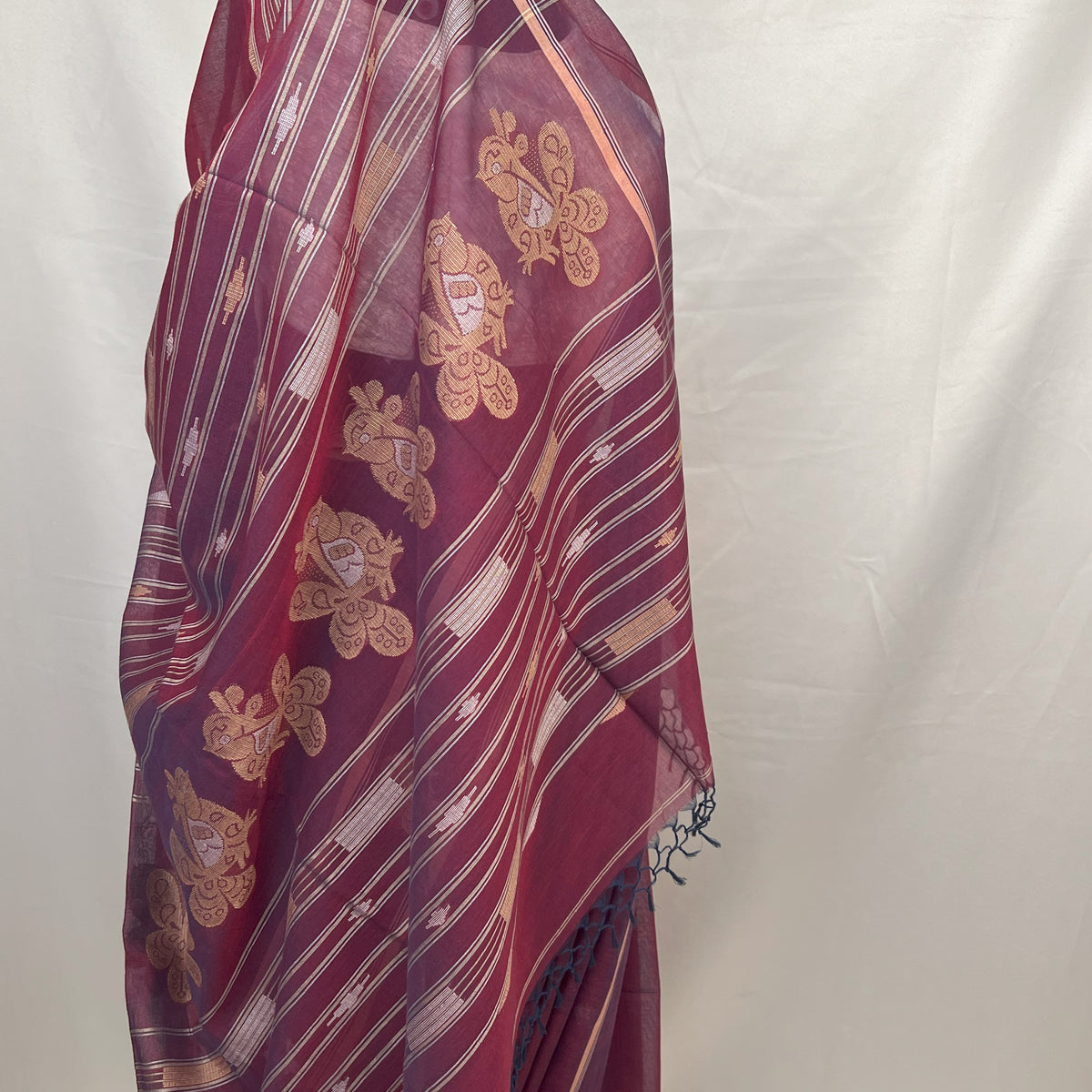 Cotton Baluchari handloom saree in peacock purple with elegant zari border for ethnic occasions.