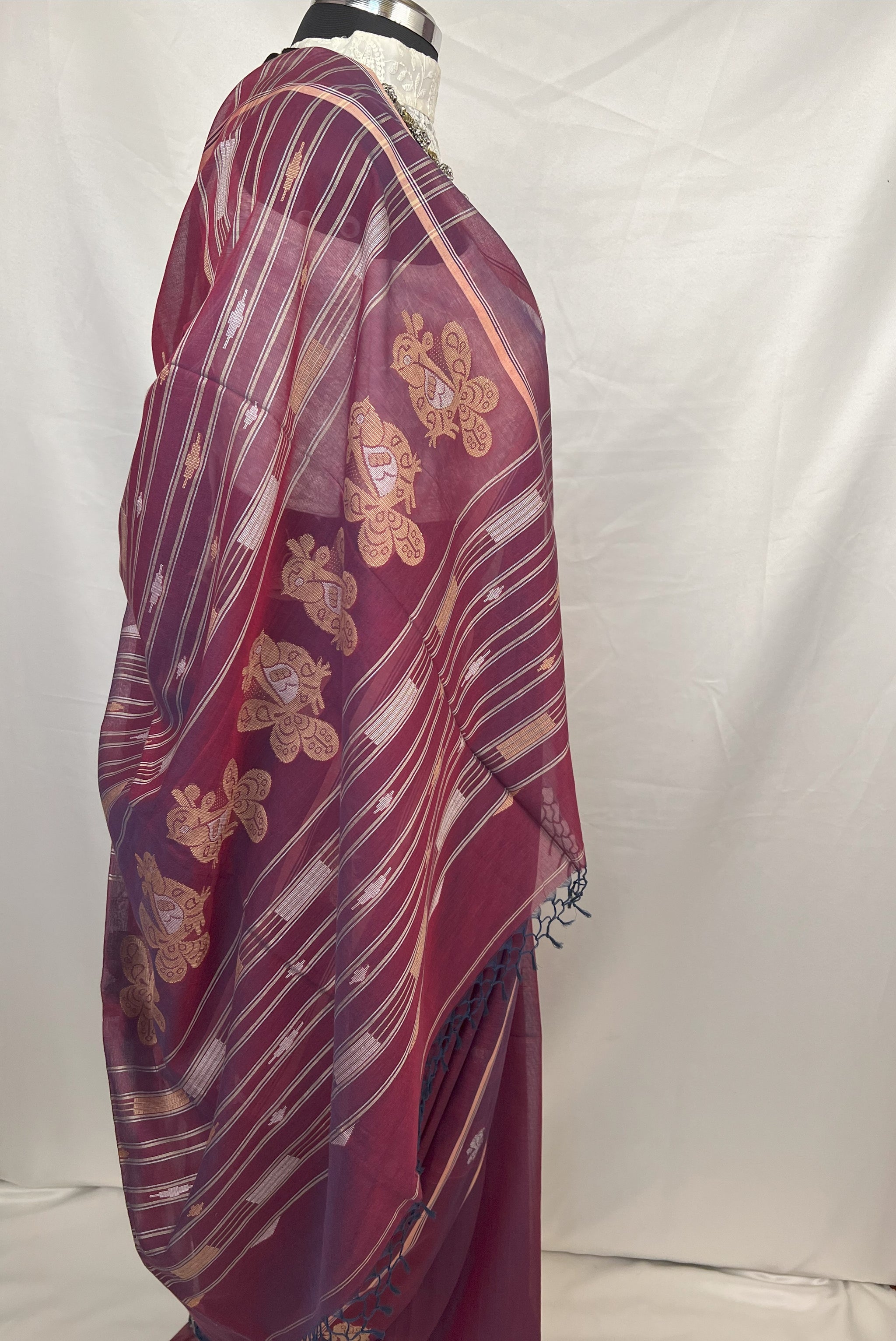 Cotton Baluchari handloom saree in peacock purple with elegant zari border for ethnic occasions.