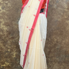 Designer red and white saree with traditional Bengali border for Puja.