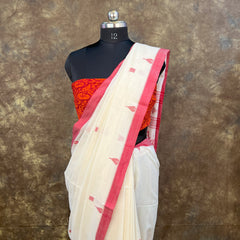 Red and white saree with matching blouse piece for Durga Puja celebrations.