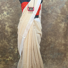 Durga Puja 2024 special white tussar saree with traditional Bengali drape.