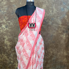 Elegant red white handloom saree for Durga Puja and Bengali festivals.
