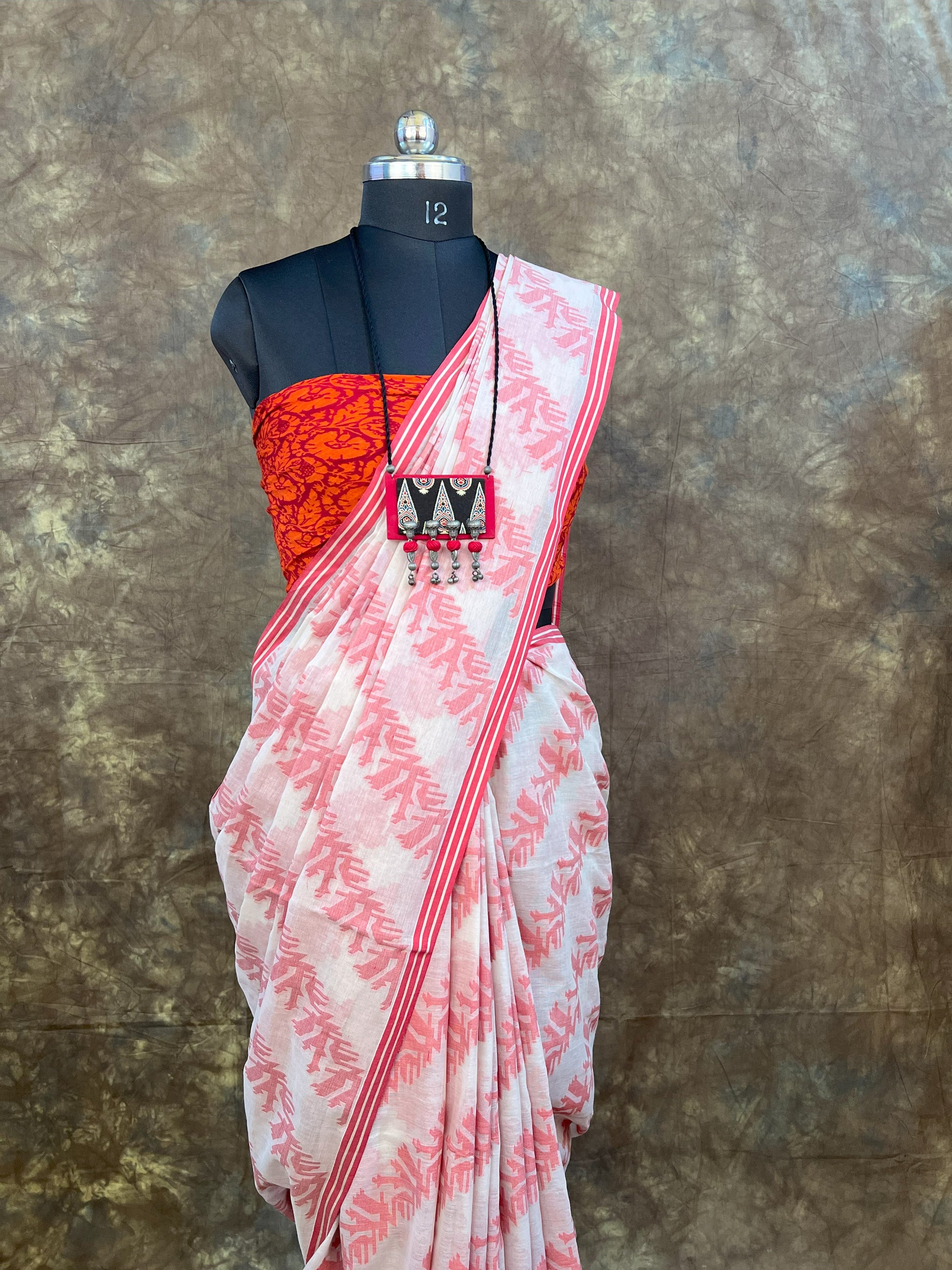 Elegant red white handloom saree for Durga Puja and Bengali festivals.