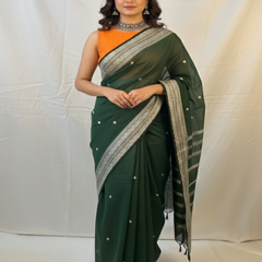 Elegant green handloom saree styled for Diwali celebration.