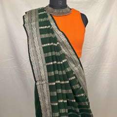 Eco-friendly green cotton handloom saree made from natural fibers.