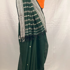 Lightweight handloom cotton saree in green for daily wear.