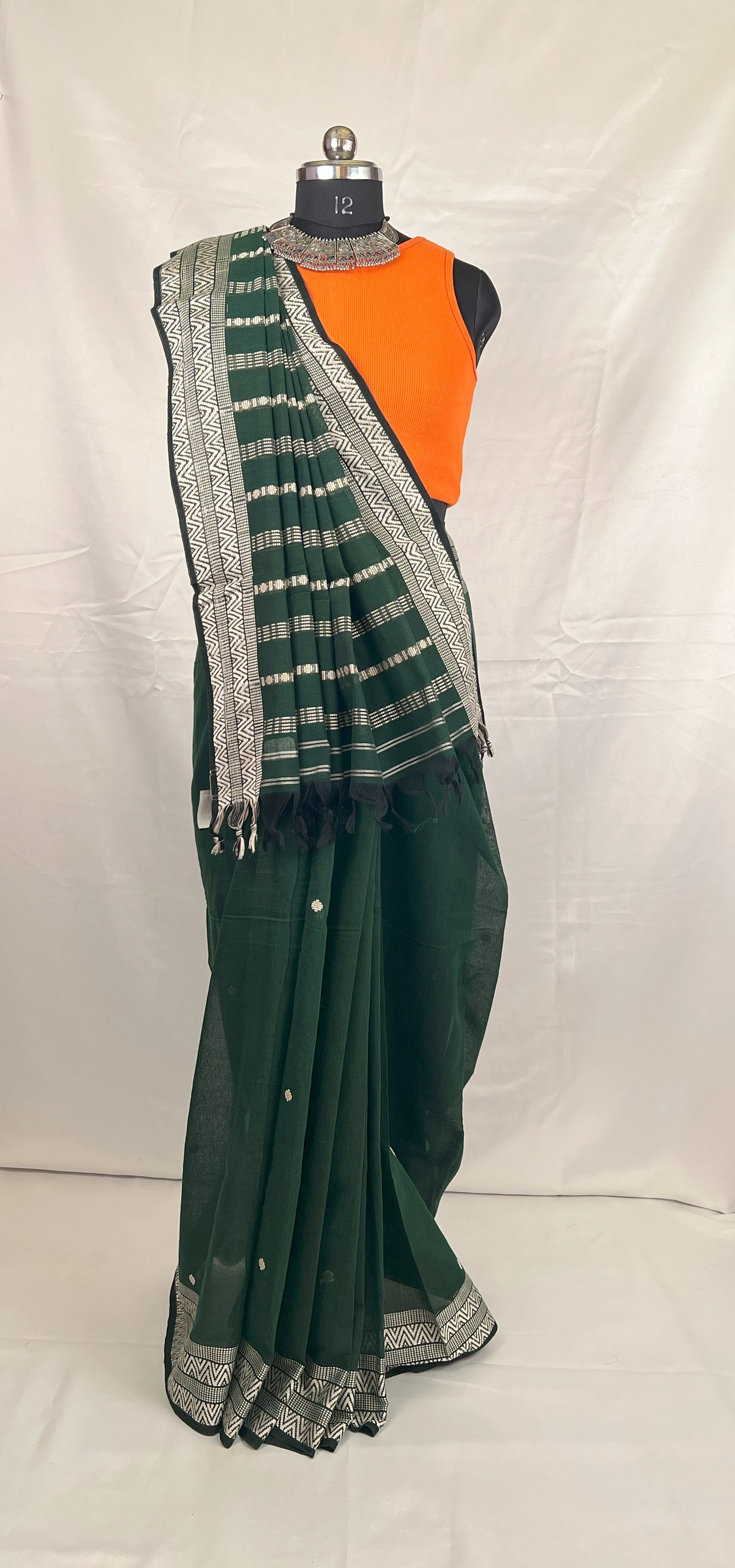 Lightweight handloom cotton saree in green for daily wear.