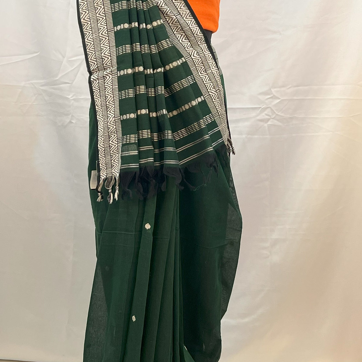 Traditional green cotton handloom saree for Navratri rituals.