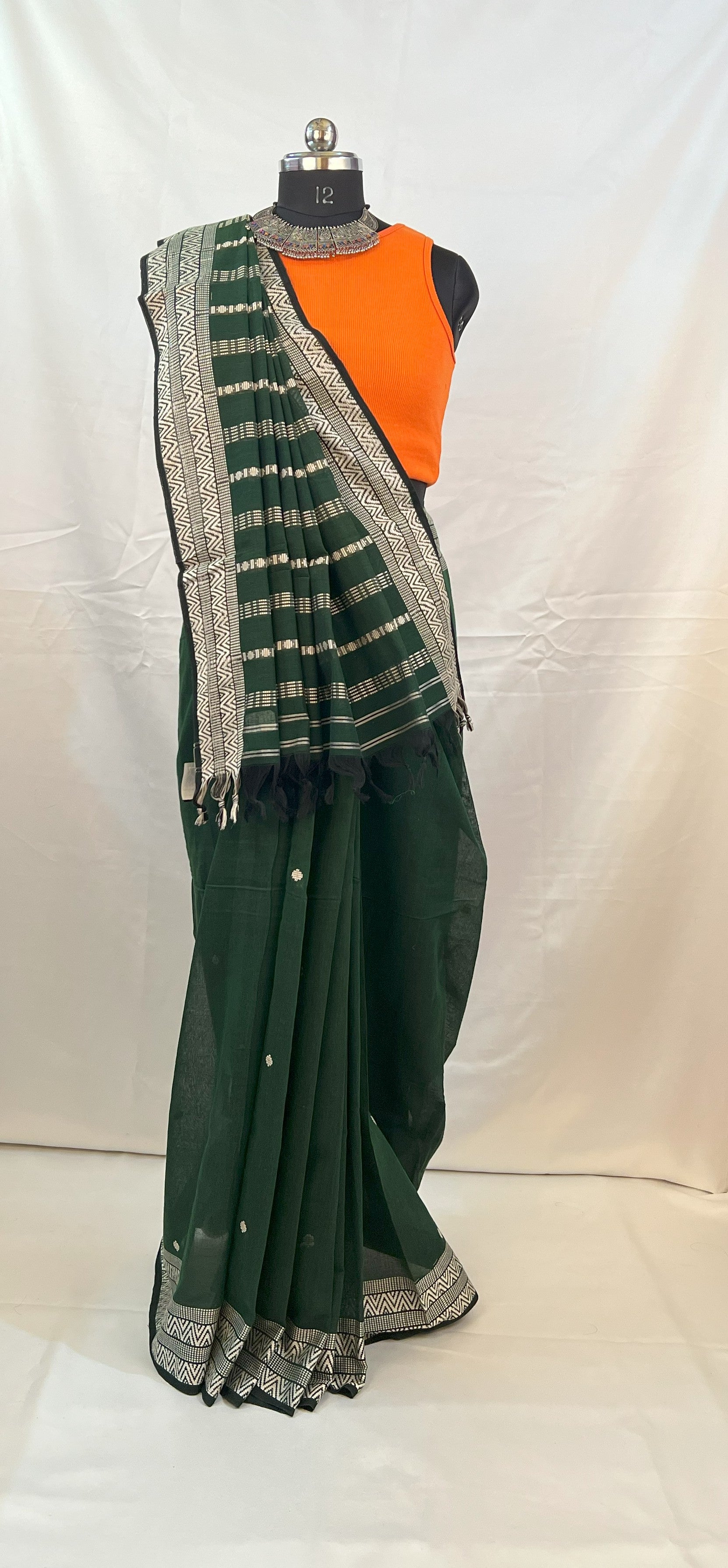 Traditional green cotton handloom saree for Navratri rituals.