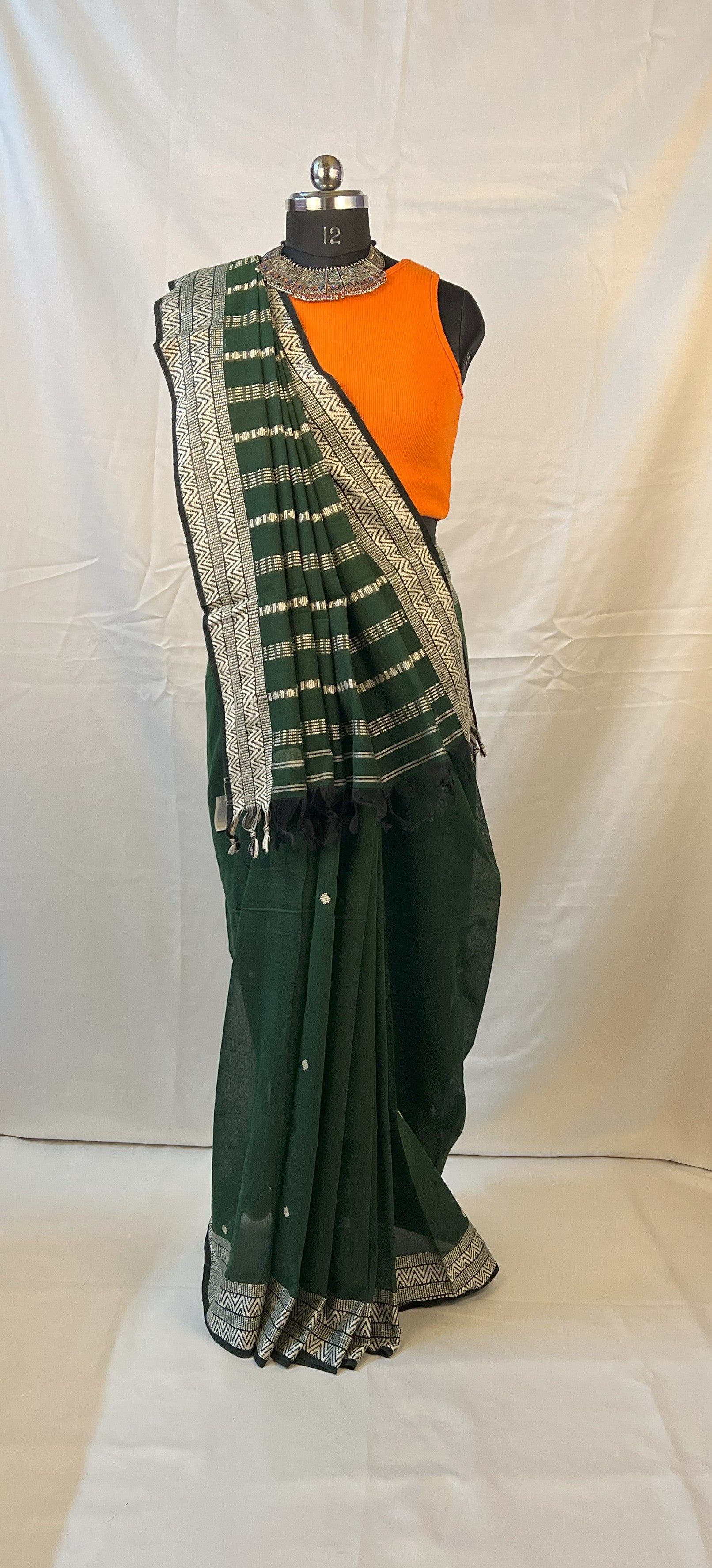 Sustainable handloom green cotton saree for festive gatherings.
