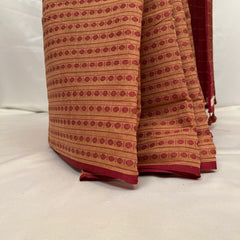 Pallu design of handwoven beige cotton saree.