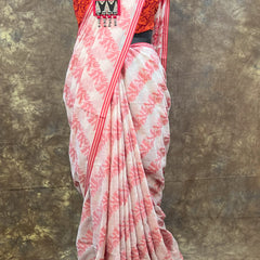 Handwoven red and white saree showcasing Bengali cultural heritage.