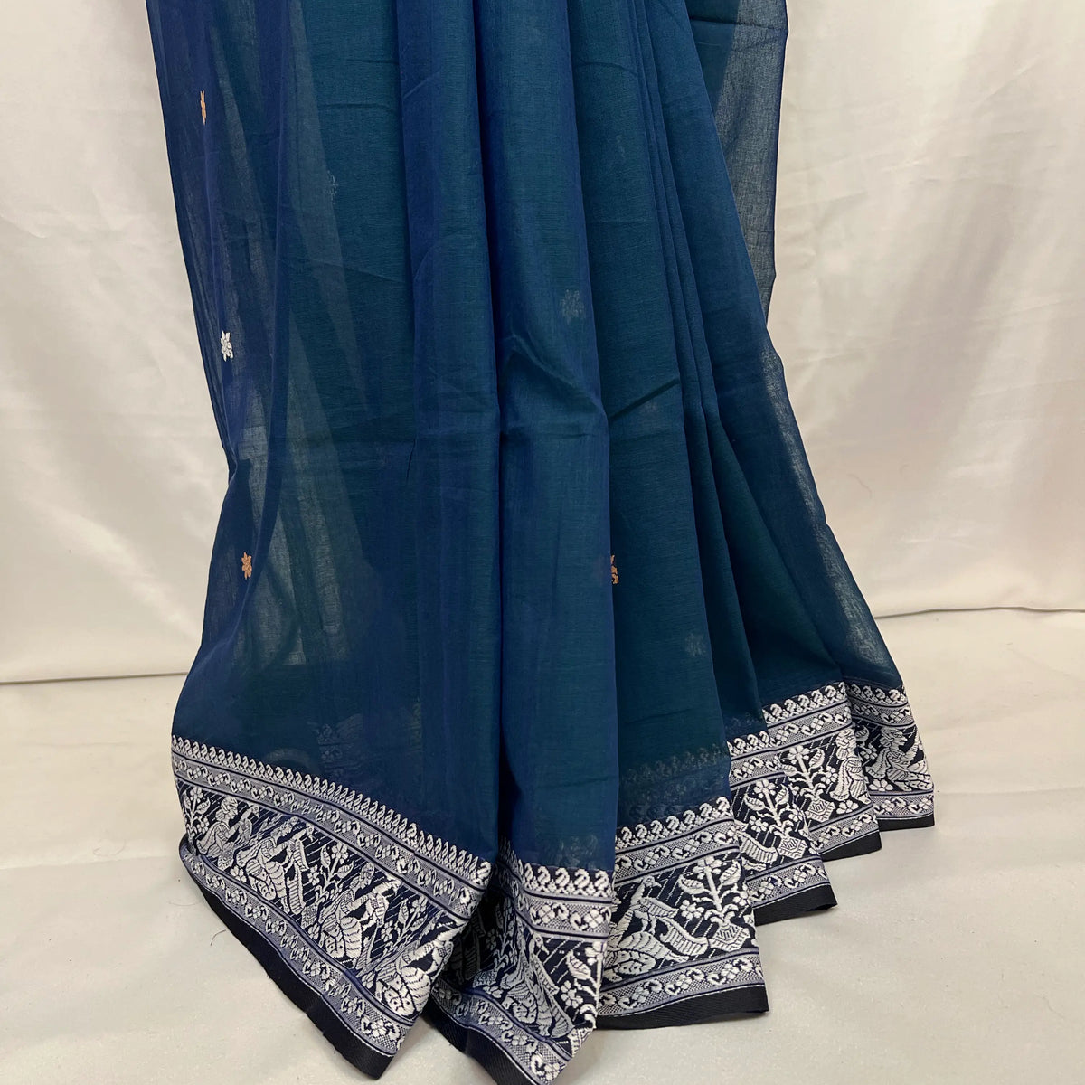 Indian handloom Baluchari saree in peacock blue cotton, perfect for festive and wedding wear.