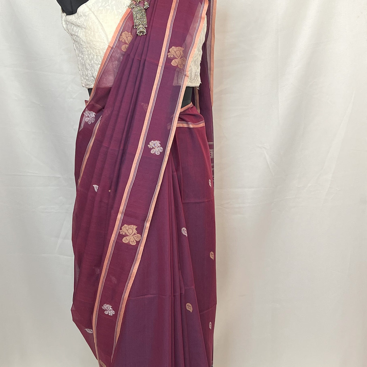 Peacock purple Baluchari saree in cotton, ideal for Bengali weddings, puja, and festive celebrations.