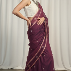 Peacock purple Baluchari saree featuring traditional Bengali motifs, handwoven by artisans of Bishnupur.