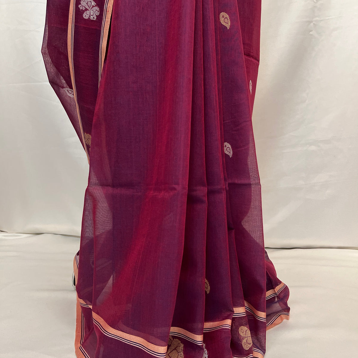 Full-length drape of peacock purple cotton Baluchari saree with handloom weaving details.