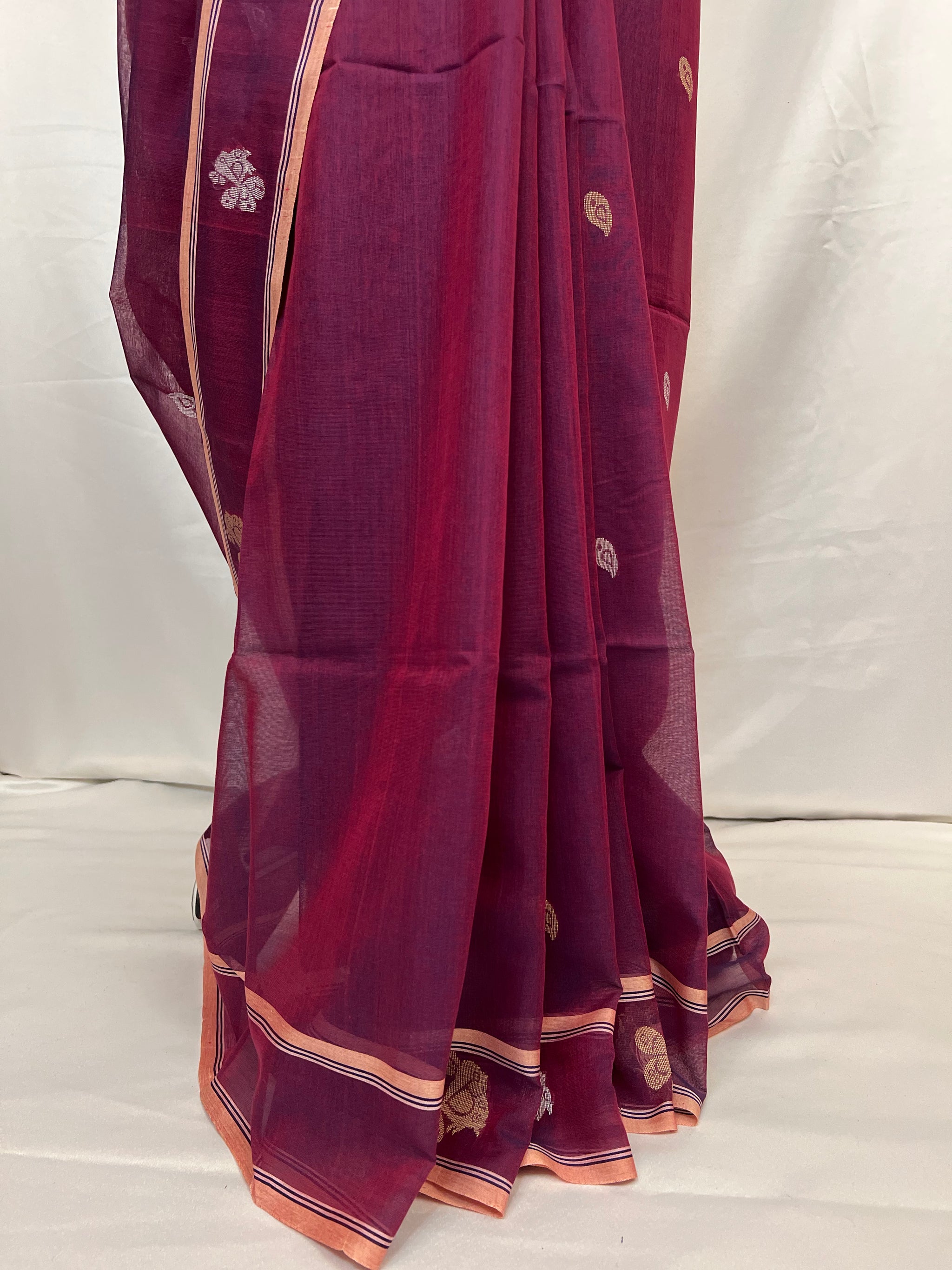 Full-length drape of peacock purple cotton Baluchari saree with handloom weaving details.