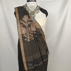 Black saree with golden border on a mannequin against a white background