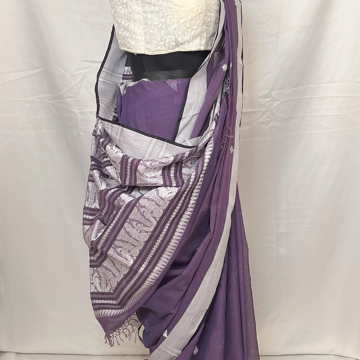 Close-up of golden zari border and woven details on Purple Handloom Baluchari Saree.
