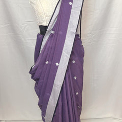 Draped mannequin showcasing Purple Cotton Baluchari Saree with intricate motifs.