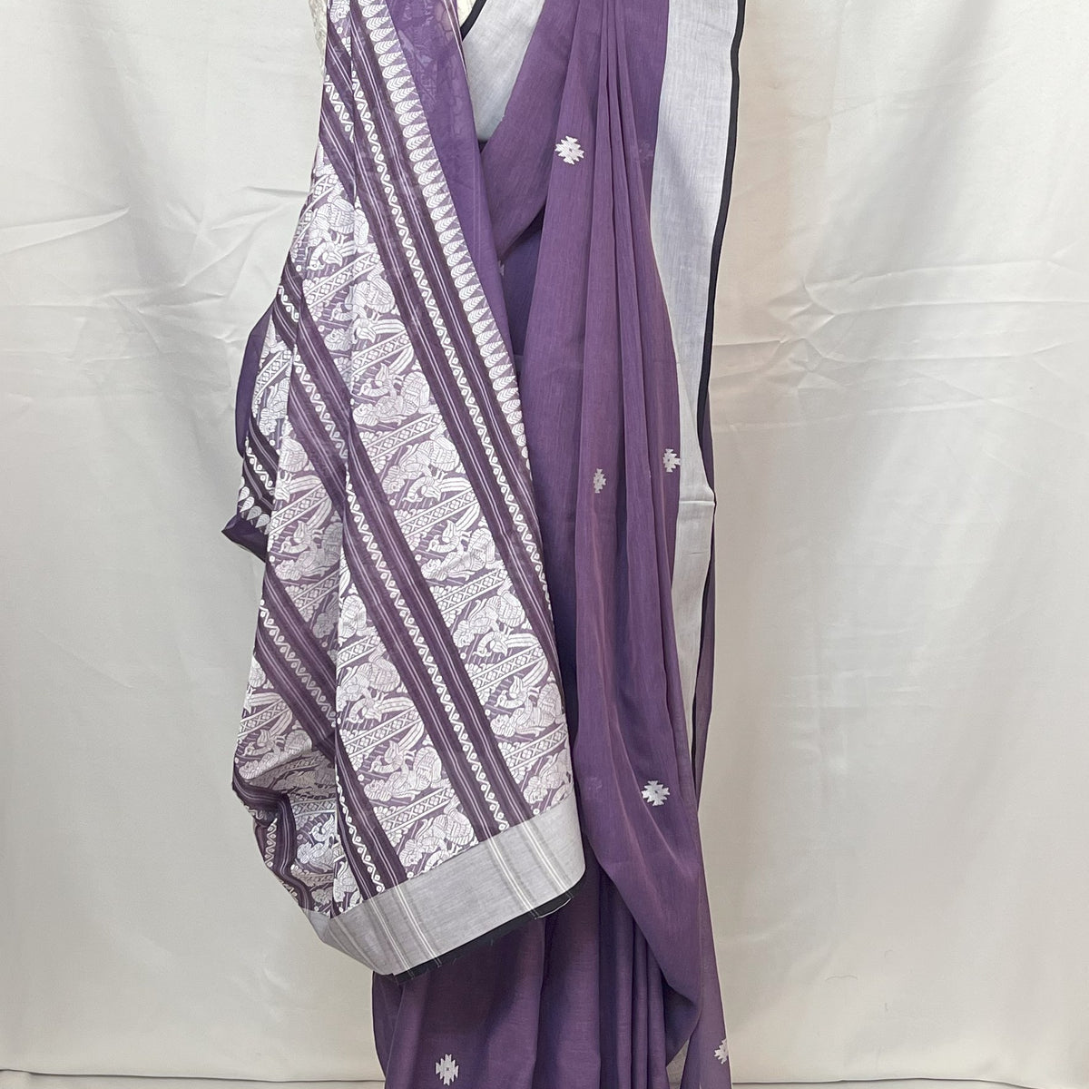 Elegant party wear look with Purple Cotton Handloom Baluchari Saree styled with jewelry.