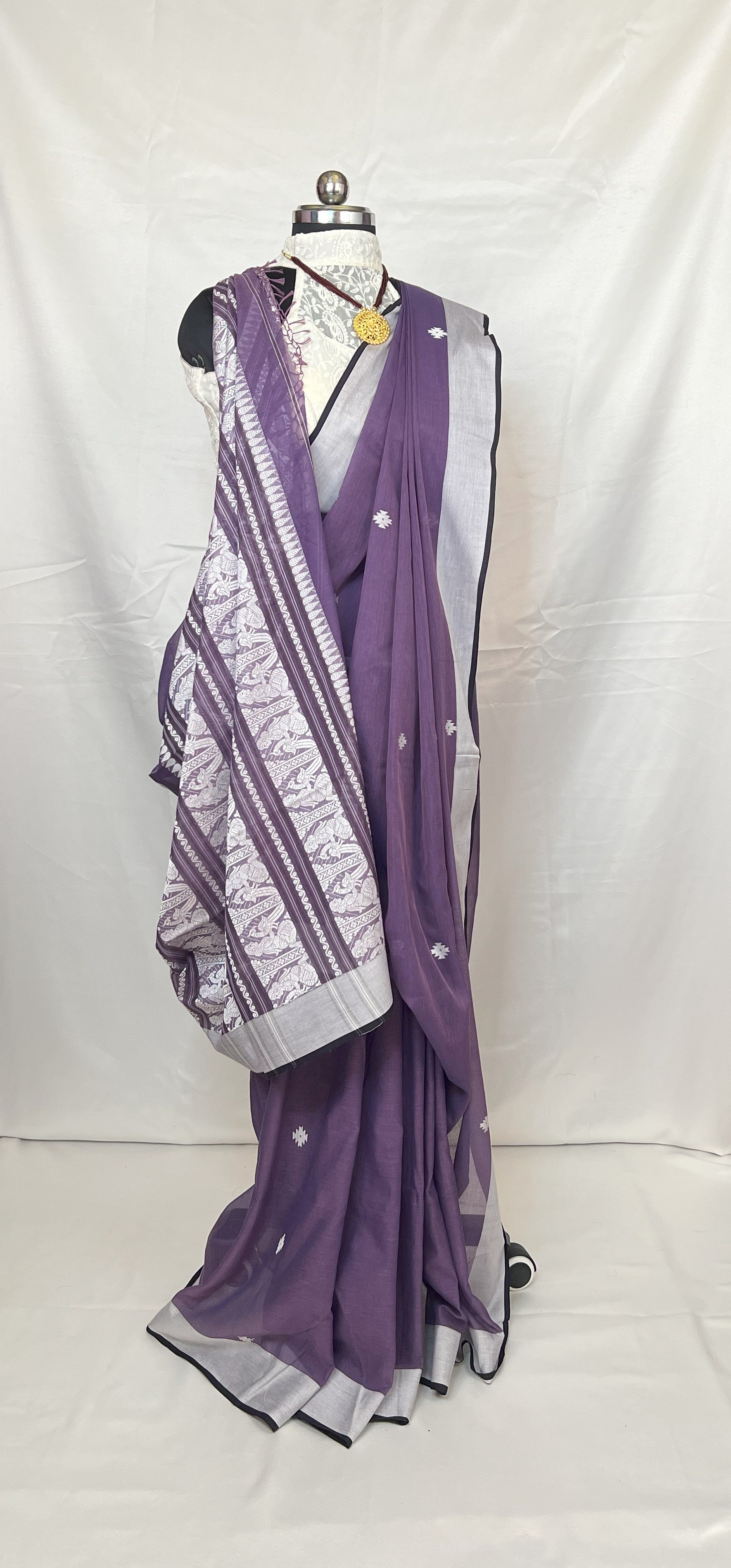 Elegant party wear look with Purple Cotton Handloom Baluchari Saree styled with jewelry.
