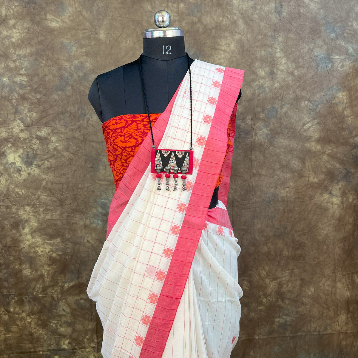 Smiling Bengali woman wearing Red White Cotton Saree for Sindoor Khela celebration