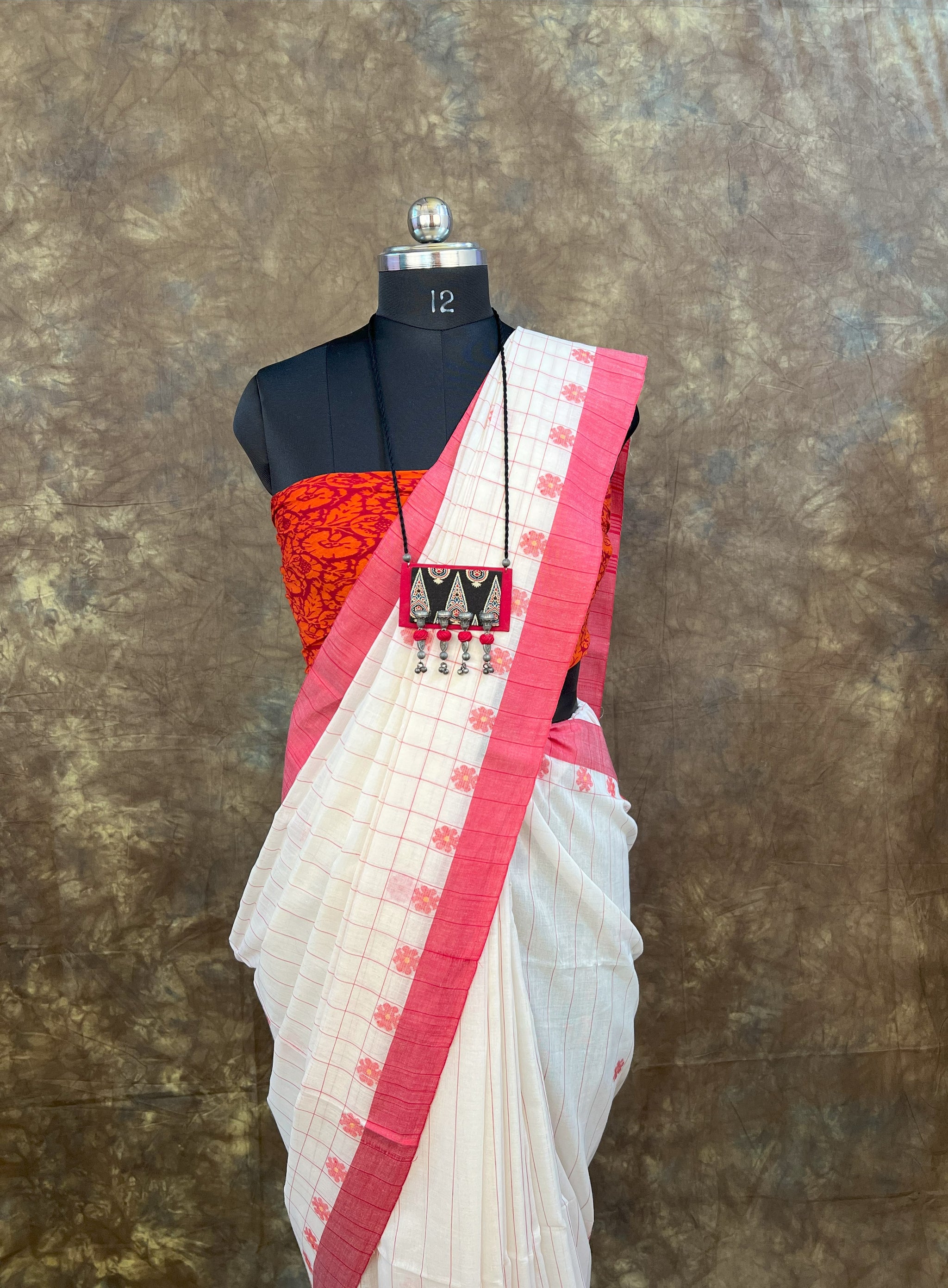 Smiling Bengali woman wearing Red White Cotton Saree for Sindoor Khela celebration