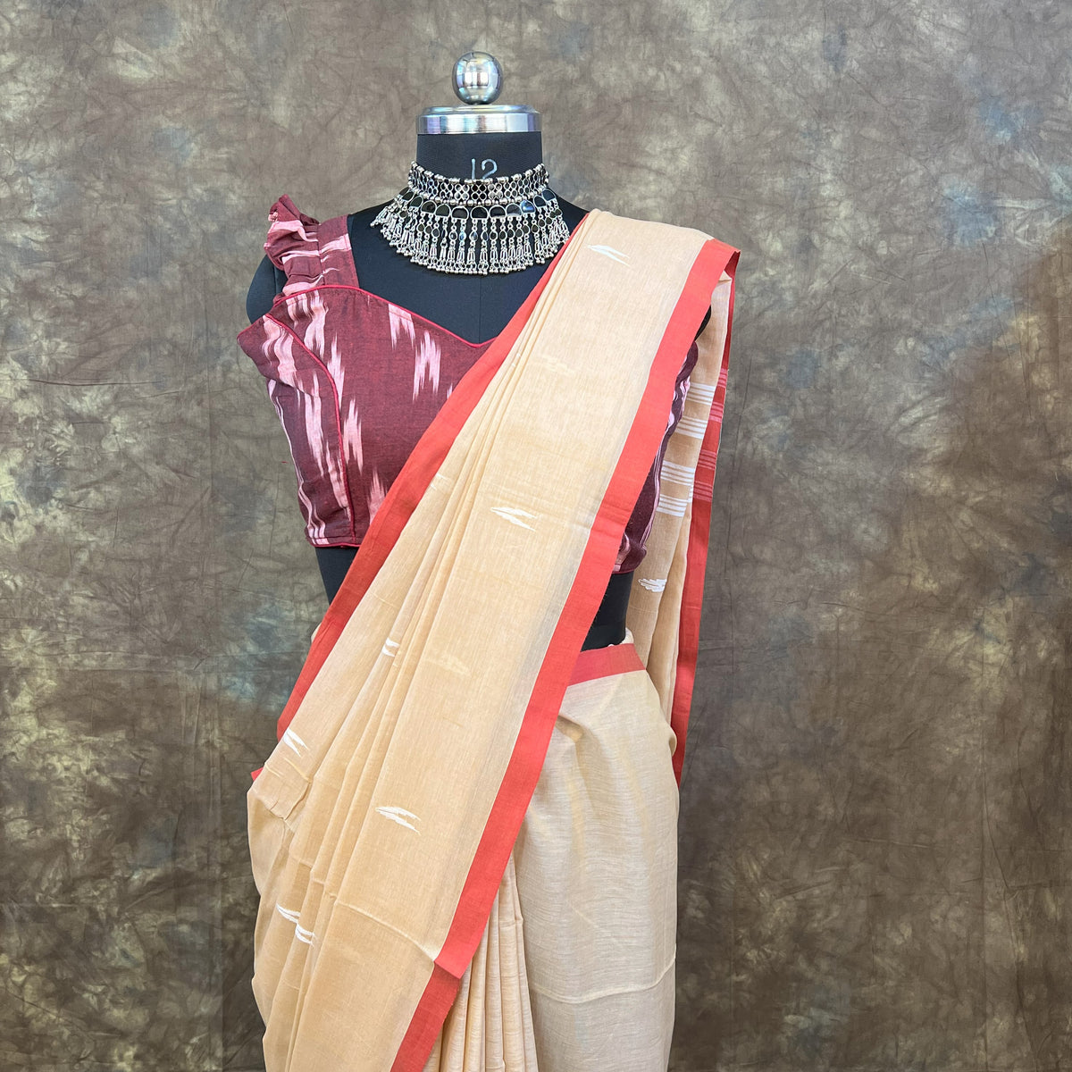 Side profile of woman wearing Red White Chandan Handloom Saree – Elegant cotton saree for weddings & puja