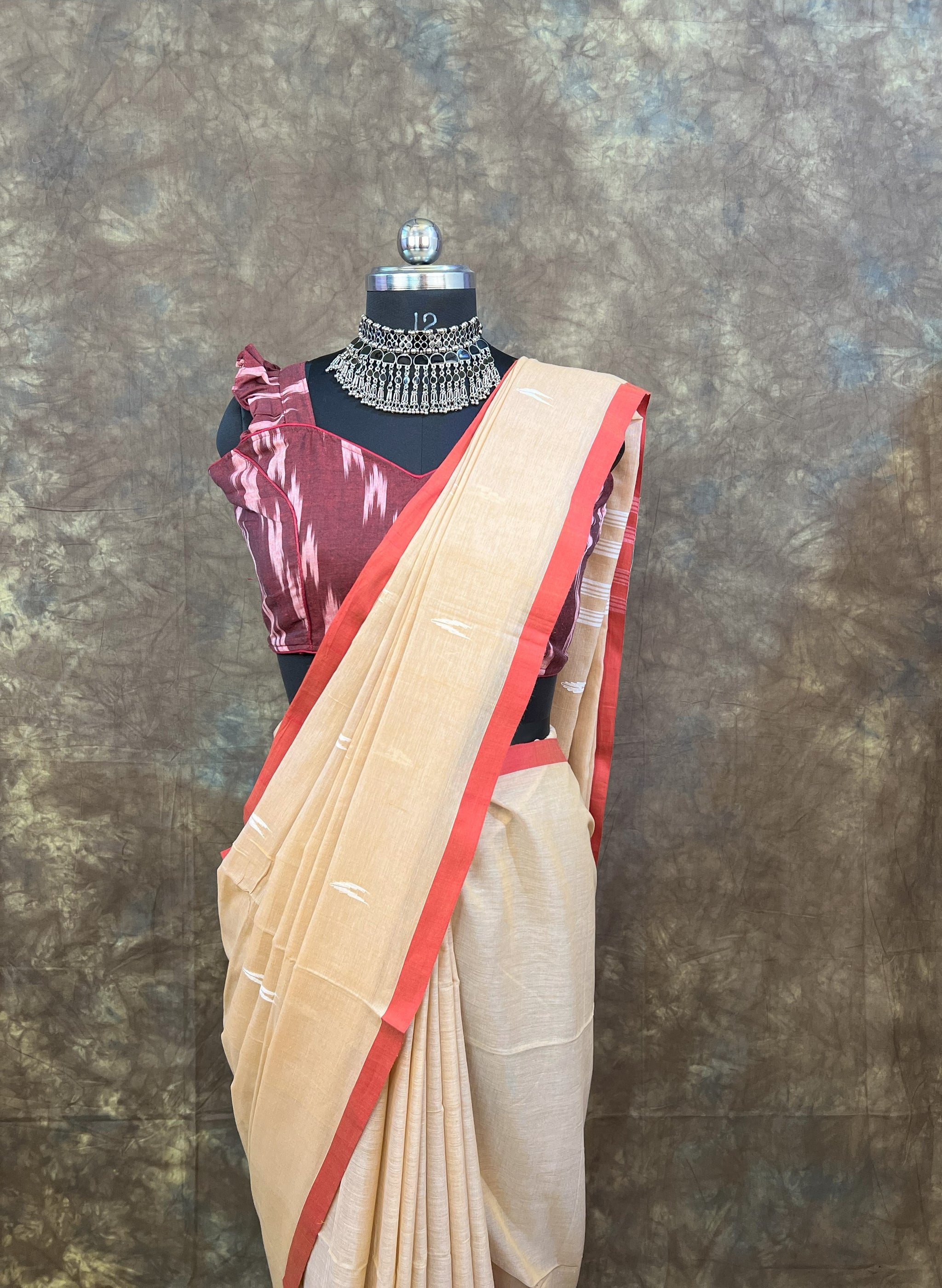 Side profile of woman wearing Red White Chandan Handloom Saree – Elegant cotton saree for weddings & puja