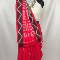 Ethnic red white handloom cotton saree styled with jewelry, perfect for traditional events.