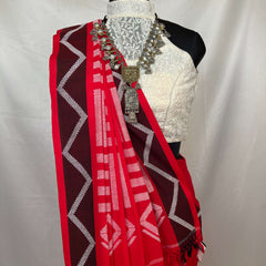 Traditional red white cotton handloom saree showcasing authentic weaving and ethnic style.