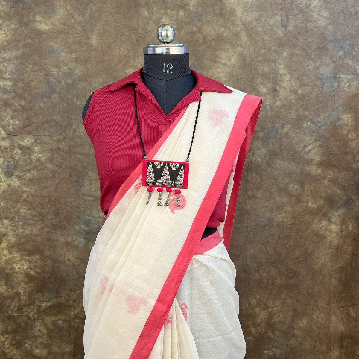 Bengali woman in Red White Handloom Cotton Saree inside Durga Puja pandal – Festive cultural wear