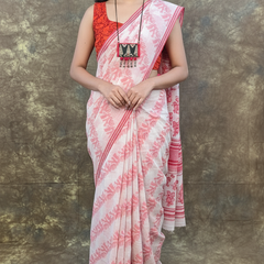 Red white handloom Bengali cotton saree for Durga Puja rituals.
