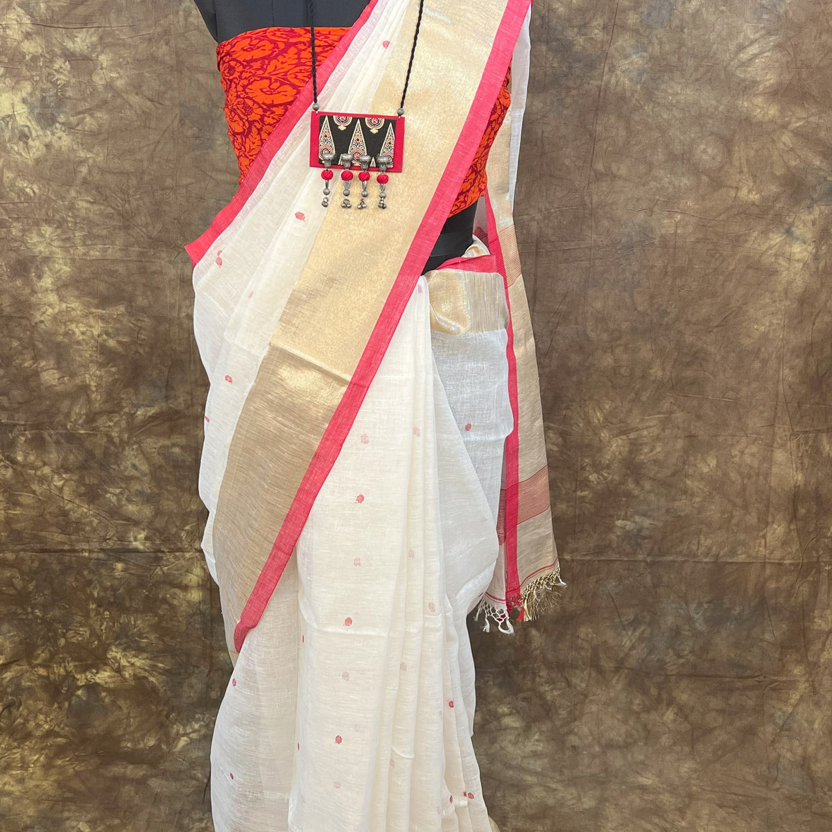 Red White Linen Saree paired with gold jewellery – Bengali festive Durga Puja look