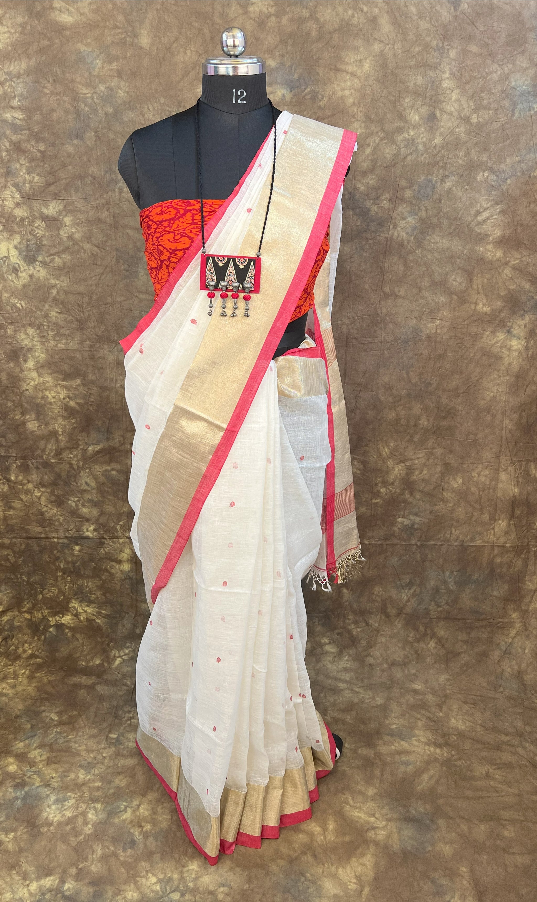 Red White Linen Saree paired with gold jewellery – Bengali festive Durga Puja look