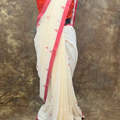 Durga Puja red and white saree draping style for women.
